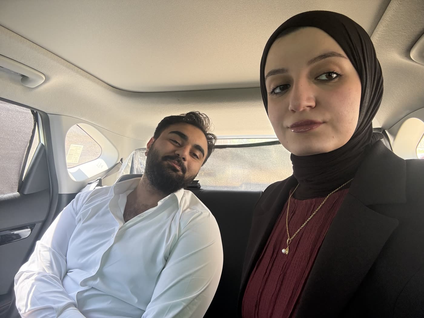 Us together in the back seat, dressed up